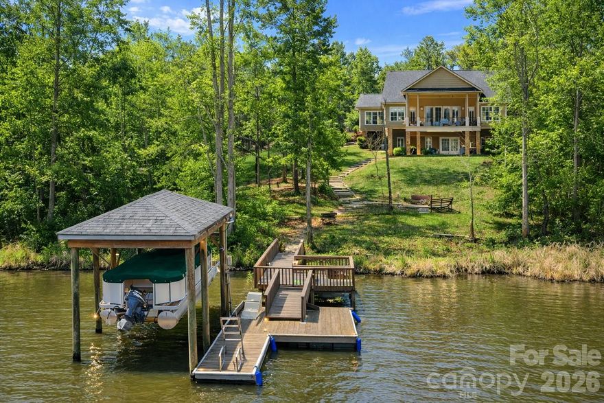 Private Waterfront Estate with Big-Water Views – Lake Wateree
Enjoy effortless lake living from day one with a stationary and floating dock, covered boat lift, and easy access to the landing—making boating, fishing, and sunset cruises seamless. Positioned in a quiet, protected cove with panoramic big-water views, this property offers the perfect balance of privacy and accessibility.
Set on 4.45 acres in sought-after Wateree Keys, this custom brick residence delivers a rare combination of space, seclusion, and elevated design—ideal as a primary home or luxury second-home retreat.
Designed for seamless indoor-outdoor living, multiple outdoor spaces provide the perfect setting for entertaining, dining al fresco, or quiet mornings overlooking the water.
Inside, timeless craftsmanship defines the home, featuring hardwood floors, extensive millwork, vaulted ceilings, plantation shutters, and a gas fireplace anchoring the open-concept living space. The chef’s kitchen is both functional and striking, offering a 5-burner gas cooktop, 42” custom cabinetry, expansive island with prep sink, and a breakfast area with cathedral ceilings and sweeping lake views. A spacious laundry room with custom shaker cabinetry adds both style and functionality.
The main-level primary suite is a true retreat, showcasing lake views, a double tray ceiling, dual custom walk-in closets, heated floors, dual vanities, walk-in shower, and direct patio access. A secondary main-level bedroom provides flexibility for guests or a private office.
The finished lower level offers exceptional versatility with high ceilings, two oversized en-suite bedrooms, a large recreation space, and a climate-controlled flex area complete with a second laundry and mini-kitchen—ideal for extended stays or multigenerational living. Additional storage and workshop space enhance functionality, while the FROG offers potential for a fifth bedroom or bonus room.
Additional highlights include an oversized garage, multiple porches, landscape lighting, lake-fed irrigation system, and covered boat lift.
Conveniently located approximately 40 minutes to Columbia and South Charlotte with easy access to I-77, this is a rare opportunity to own a private, large-acreage waterfront estate on Lake Wateree.
Unmatched setting. Elevated lake living. A truly rare offering.