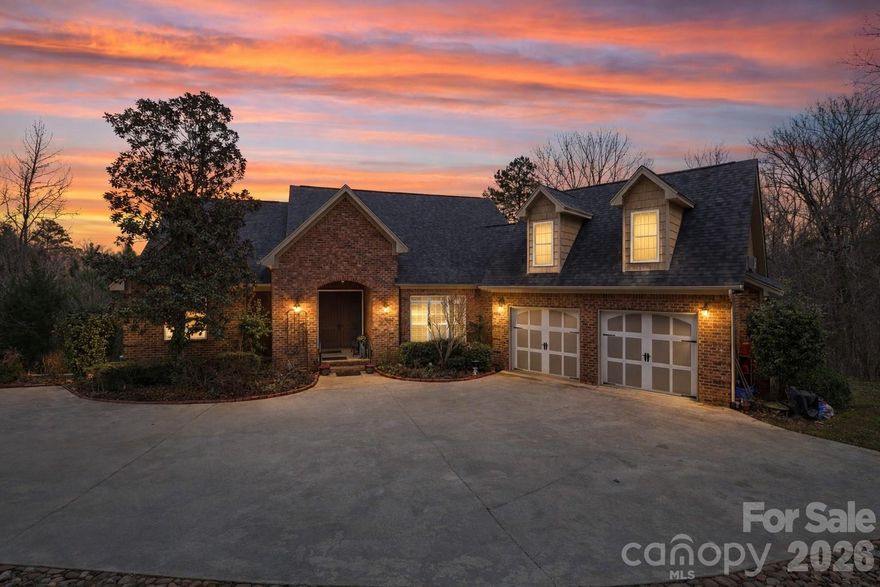 Entertainer’s Dream Meets Private Waterfront Oasis – Lake Wateree. Welcome to your picture-perfect retreat in sought-after Wateree Keys on beautiful Lake Wateree. Perfect as a primary residence or second home escape, this exceptional waterfront property offers the best of both worlds — ultimate privacy and breathtaking big-water views from a peaceful, quiet cove. Situated on an expansive 4.45 acres, this custom brick home is designed for effortless indoor-outdoor living. A stationary and floating dock, covered boat lift, and easy access to the landing make lake days seamless, while multiple outdoor living spaces create the perfect setting for sunset dinners, gatherings with friends, or quiet mornings by the water. Inside, you’ll find timeless craftsmanship and thoughtful design throughout — gorgeous hardwood floors, extensive moldings, soaring vaulted ceilings, Southern shutters, and a cozy gas fireplace anchoring the open floor plan. The entertainer’s kitchen is a showstopper, featuring: 5-burner gas cooktop, 42” custom cabinetry, Expansive center island with prep sink, Breakfast area with cathedral ceilings and panoramic lake views, A spacious laundry room with newly installed shaker-style cabinetry adds both beauty and function. The main-level primary suite is a true retreat, offering expansive lake views, a double tray ceiling, dual custom walk-in closets, heated floors, double vanities, walk-in showers, and direct patio access for serene waterfront mornings. A secondary bedroom on the main level provides flexibility for guests or home office needs. The finished basement impresses with high ceilings and two oversized private suites, each with walk-in closets and en-suite baths. Additional features include a large recreational/living area, climate-controlled flex space with a second laundry and mini-kitchen, abundant storage, and workshop space — ideal for multigenerational living or extended guests. The FROG offers potential for a fifth bedroom or bonus space. Additional highlights include, Oversized garage, Two additional porches, Landscape lighting, Lake-fed irrigation system, and Covered boat lift. Conveniently located approximately 40 minutes to downtown Columbia and South Charlotte with easy access to I-77, this is a rare opportunity to own a private waterfront estate with unmatched views and space on Lake Wateree. Incredible opportunity. Unforgettable setting. Your lake life begins here.