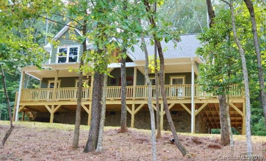 New Construction situated on 1.367 private acres with select cut timber! Most unique 3BR/2.5BA custom home built to the highest standard.  Hardiplank siding, energy efficient windows, mahogany entry door, architectural shingles, covered wrap-around porch. From the point of entry, gorgeous custom millwork & quality details impressively unfold. Cathedral ceilings & oversize windows create an expansive light, open living plan. Living room features custom river rock gas fireplace. Handsome stairway boasts custom cedar newels & iron pickets. Eat-in kitchen features custom handpicked knotty hickory cabinets, granite countertops & bar. French doors open to wrap-around deck. Spacious owner's suite on main level features walk-in closet, & ensuite ceramic tile bath, hickory vanity & granite countertops. Large landing on second level would make great media room/office. Two bedrooms & full bath on second level. 4 1/2 inch hardwood floors throughout living areas.
