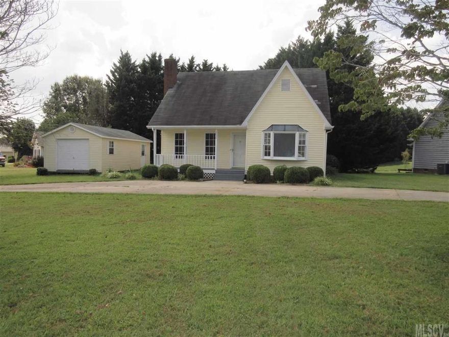Two bedroom/two bath outside city limits. Home includes new carpet, counter tops, vinyl, paint, outbuilding and new deck, 2 bonus rooms with closets upstairs. Walk across the street to school. There is a small room with closet on main level ideal for nursery, office or play room.
