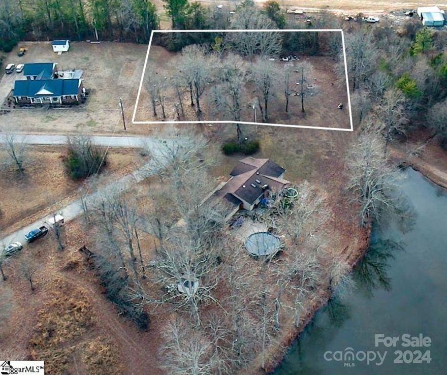 Beautiful building lot w a pond view in a great location, so close to Landrum and only a short drive to downtown Spartanburg or Greenville. Lot ismostly cleared and ready for you to build your dream home. Public water is available.