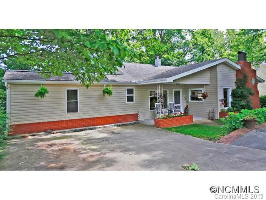 Original charm with many upgrades such as  kitchen & great room area w/exposed beams, large windows for natural light, beautiful wood floors, fireplace, relaxing front covered porch, Comes furnished and would make great second home or empty nester, One level living & Low maintenance yard. Just a 5 minute walk from beautiful downtown Waynesville.