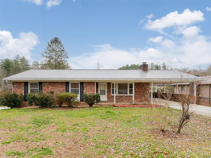 Welcome home to this timeless mid-century offering the perfect blend of classic charm and modern convenience. Step inside, and be greeted by the warmth of hardwood floors that gracefully guide you through the main level of this three-bedroom, two-bath haven. The heart of this residence is the updated kitchen that seamlessly marries style and functionality. The upgraded baths echo this commitment to quality, ensuring a retreat-like experience for relaxation and rejuvenation. Venture downstairs to discover the potential of the unfinished basement, complete with a working stove and a dedicated workspace, it provides the ideal setting for canning or keeping dishes warm during larger gatherings, fostering a sense of creativity and convenience. Nestled on one acre of mostly flat, open land leading to a bold creek in the back where you can create the perfect outdoor oasis.  5 minutes to Pisgah Natl Forest and 12 min. to Dupont State Forest & the best hiking and mountain biking in the South.