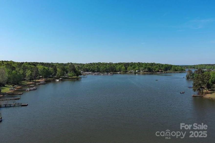 Unwind with sunset views at this lakefront gem in the coveted Beaver Creek area of Lake Wateree! This cozy stick-built home is the ultimate retreat, nestled on a quiet dead-end road just minutes from restaurants, boat rentals, and the marina. Renovated in 2007, it features an open floor plan, cathedral ceilings with exposed beams, granite countertops, modern appliances, central air, and a gas fireplace. Relax on the spacious screened-in porch with peaceful lake views. Recent upgrades include new windows (2019) and a new roof (2021). Extras like a private pier, your own boat ramp, outdoor shower, and large crawl space add even more value. Whether you're seeking a weekend escape, full-time lake life, or a top-tier Airbnb investment—this one has it all. Lake season is here—don’t miss your chance to make this turnkey waterfront home yours!