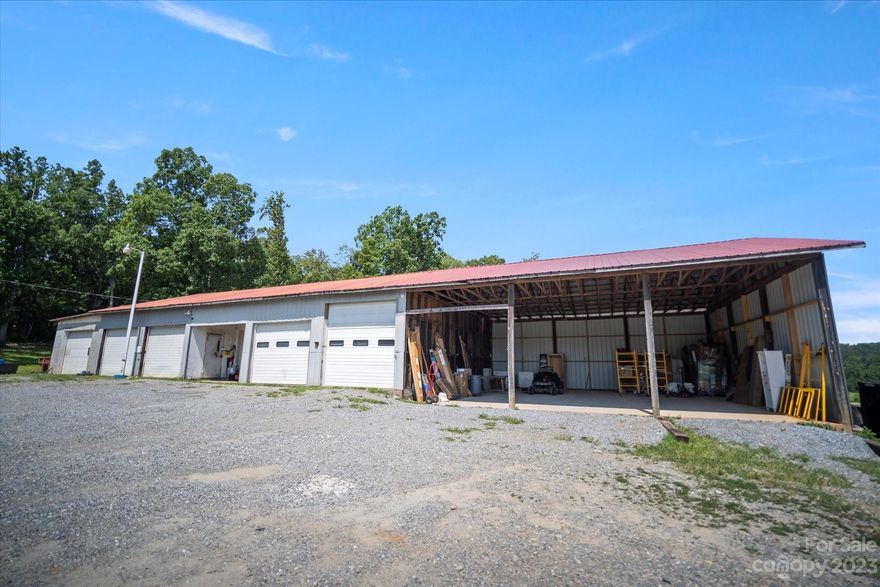 Business opportunity awaits! Expansive closed six bay 80x40 workshop with an attached open 35x35 three bay covered garage with concrete floor. The shop is set up with eight security cameras you can view anywhere from your phone, 80 gallon air compressor, washroom bay with drain, lots of storage. Large parking area on this recently surveyed lot containing 1.88 acres. Bonus features include RV hook-up site at the lower end of the property and plenty of road front footage with easy access from Hwy 226 South. If you need additional garage/business space see MLS#4084490 for more information about the lower Garage building available.