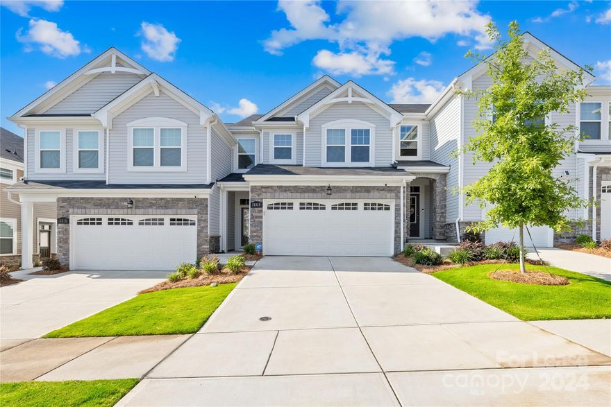 Like-new, 2-story townhouse built in 2023, featuring 3 bedrooms and 2.5 bathrooms across 1815 sqft, with a 2-car front-entry garage, located in Steele Creek's Porters Row, available NOW! The first floor includes a breakfast area, kitchen, family room with fireplace, a half bath, and ample storage under the stairs. The second floor offers a spacious master bedroom with a walk-in closet and an ensuite bathroom with a stand-in shower and garden tub, two additional bedrooms, a full hallway bathroom, and a laundry room.

Enjoy Steele Creek's attractions, including shopping at Charlotte Premium Outlets and Rivergate shopping district. Nearby Ayrsley provides dining and entertainment options, with convenient access to I-485, I-77, the airport, and uptown Charlotte. The proximity to Lake Wylie adds extra charm.

Rent includes HOA fees, lawn maintenance, refrigerator, washer, and dryer. Tenants are responsible for water and electricity.