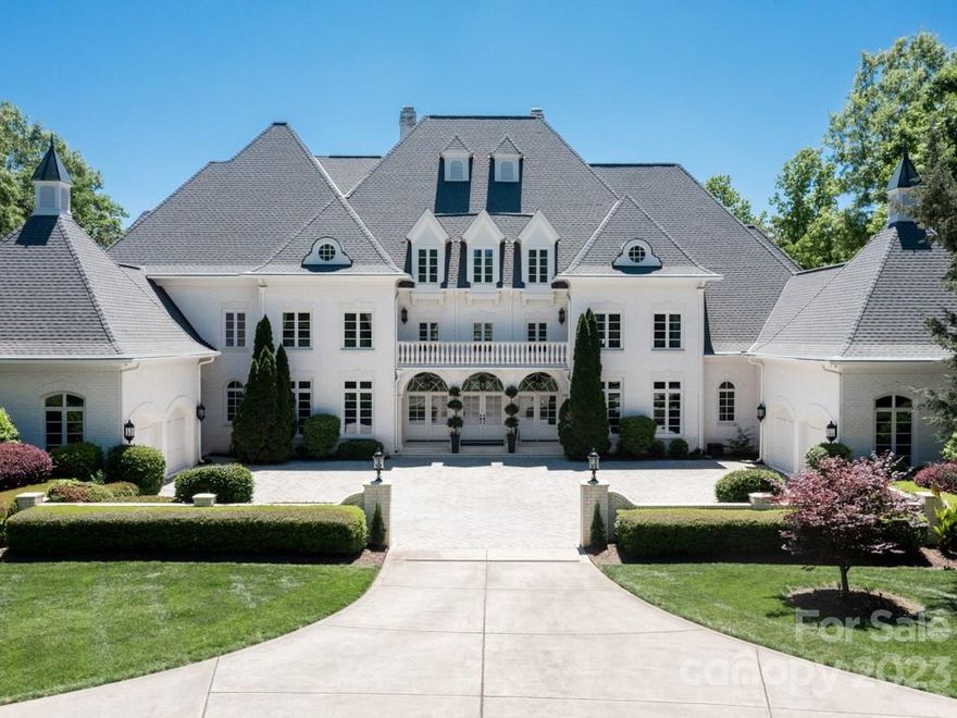 Over 13,000 square feet of the highest build quality in exclusive gated Sedgefield on a sprawling 4.6 acres. The view is breathtaking as you enter the estate along the winding driveway.  The grand double-height foyer with dual staircase and great room exude elegance.  The kitchen/butler's pantry/wine room are perfect for large scale entertaining.  All bedrooms have ensuites. The resort backyard features an enormous pool and heated spa all overlooking the water.  The pool house offers 1700 square feet of additional recreational space. Privacy & luxury are defined in this extraordinary waterfront estate home. This is a fantastic estate to enjoy nature and the temperate climate of North Carolina. Top Rated Marvin Ridge Schools!