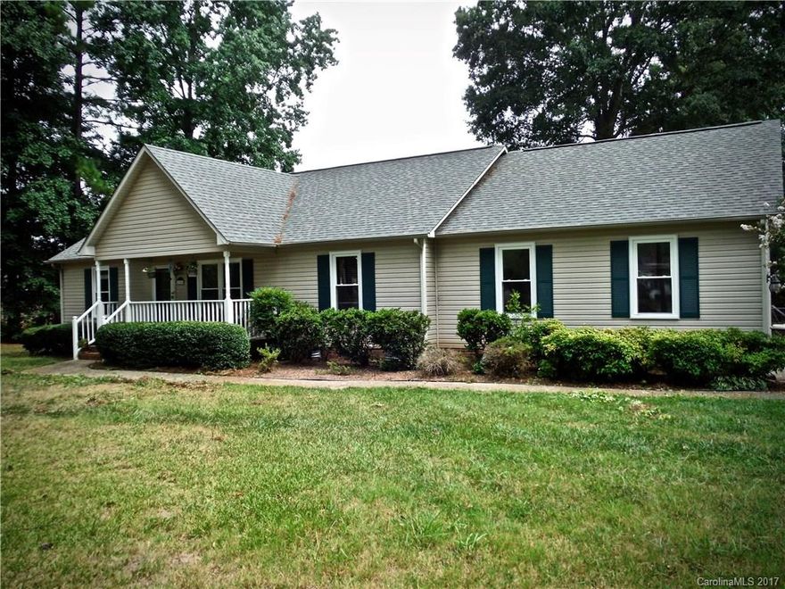 Great 3 bedroom 2 bath home on spacious lot in the rapidly growing Rock Hill area!  The house is nestled on a BEAUTIFUL FENCED WOODED LOT WITH POOL, attached two car garage & a detached one car garage that can be used as a workshop. Features include HARDWOODS in living and dining, SPACIOUS KITCHEN, ceiling fans throughout, covered front porch & screened back porch off kitchen.  New windows installed in 2013, hot water heater replaced in 2014, brand new pool pump.