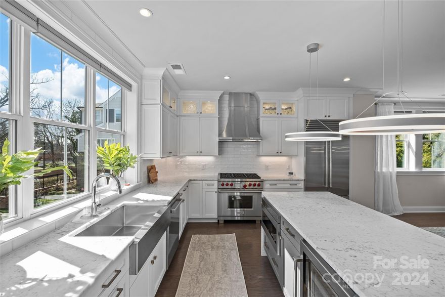 Luxurious Simonini built townhome in Cotswold "Proper" offers 2710 sqft of refined living space. Prime location near Cotswold Village and Providence Village for shopping and dining. End unit with 3 beds, 3.5 baths, flooded with natural light featuring hardwood floors and high ceilings. Custom all-glass elevator services all 3 levels, chef's kitchen with Wolf/Sub-Zero appliances, marble counters, waterfall island and walk-in pantry. Elegant dining/living area with expansive sliders to balcony. Primary suite features spa-like bath, walk-in closet with laundry. Guest bedroom offers ensuite bath and walk-in closet. Lower level offers third bedroom with expansive sliders to a charming courtyard, plus a full bath and access to double garage. Perfect blend of luxury and convenience, just minutes from Center City and South Park. Can't beat the quality and location for the price!