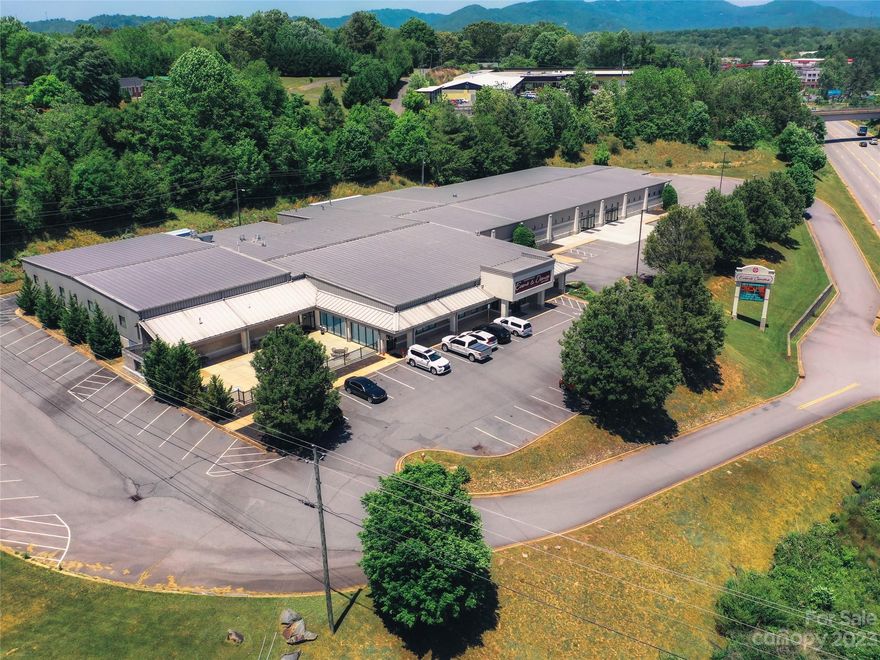 A rare opportunity to own just over 40,000sf near I-40 at a signalized intersection on Sweeten Creek Road.  This highly flexible structure is clear span construction for an easily modifiable interior and includes numerous roll-up doors as well as three docks, areas already laid out for office, two wings of the building include high ceilings over slab ideal for warehousing or light industrial and manufacturing. Zoned commercial industrial, this property could be ideal for many uses ranging from medical office to industrial uses.