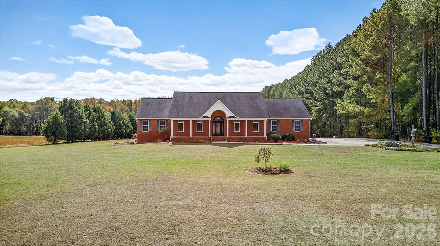 A rare opportunity just became even better-now $849,900 for 7.5 private acres, a full-brick ranch, heated walk-out basement, barn, pool, and endless flexibility. Welcome Home to 3987 Highway 27 W in Lincolnton! This full-brick, custom ranch beautifully combines comfort, function, and Southern Charm. From the moment you arrive, the welcoming rocking chair front porch invites you to sit back, relax, and enjoy peaceful views of the front yard and open fields beyond. Nestled on 7.5 serene acres with a small stream, fenced yard, above-ground salt water pool, and a versatile barn—this property is ideal for those dreaming of country living, a mini farm, or simply extra space for hobbies and toys. Inside, fresh neutral paint throughout this home, nearly 3,500 sq. ft. on the main level plus 1,900+ sq. ft. in the walk out basement provide incredible space and flexibility for any lifestyle. The bright, open floor plan features hardwood and tile flooring, soaring ceilings, and cozy gas log fireplaces in both the great room and primary suite. The chef’s kitchen offers granite countertops, a gas cooktop, stainless steel appliances, bar seating, and a sunny breakfast area—plus a separate dining room perfect for gatherings and holidays. The spacious primary suite includes a walk-in shower and generous closet space, while three additional bedrooms and a laundry room with cabinetry complete the main level. Downstairs, the partially finished basement offers a large recreation room, full bath, and abundant storage—it could easily be finished as a second living quarters, ideal for multi-generational living, guests, or an in-law suite. Enjoy two garages—one for parking and one designed for your workshop—with a convenient lift elevator for easy access to the main level. Step outside to the rear patio and soak in the tranquility of your private retreat. Are you a gardener? You’ll love the open, sun-filled space ready for your dream garden. Don’t miss this opportunity—ranch-style living at its finest, with room to grow, relax, and make lasting memories! With a little TLC and your personal touch, this could truly become your dream property! Easy access to HWY 321, Lincolnton, Hickory, Vale and Surrounding areas. CLT International Airport is only 38 miles!