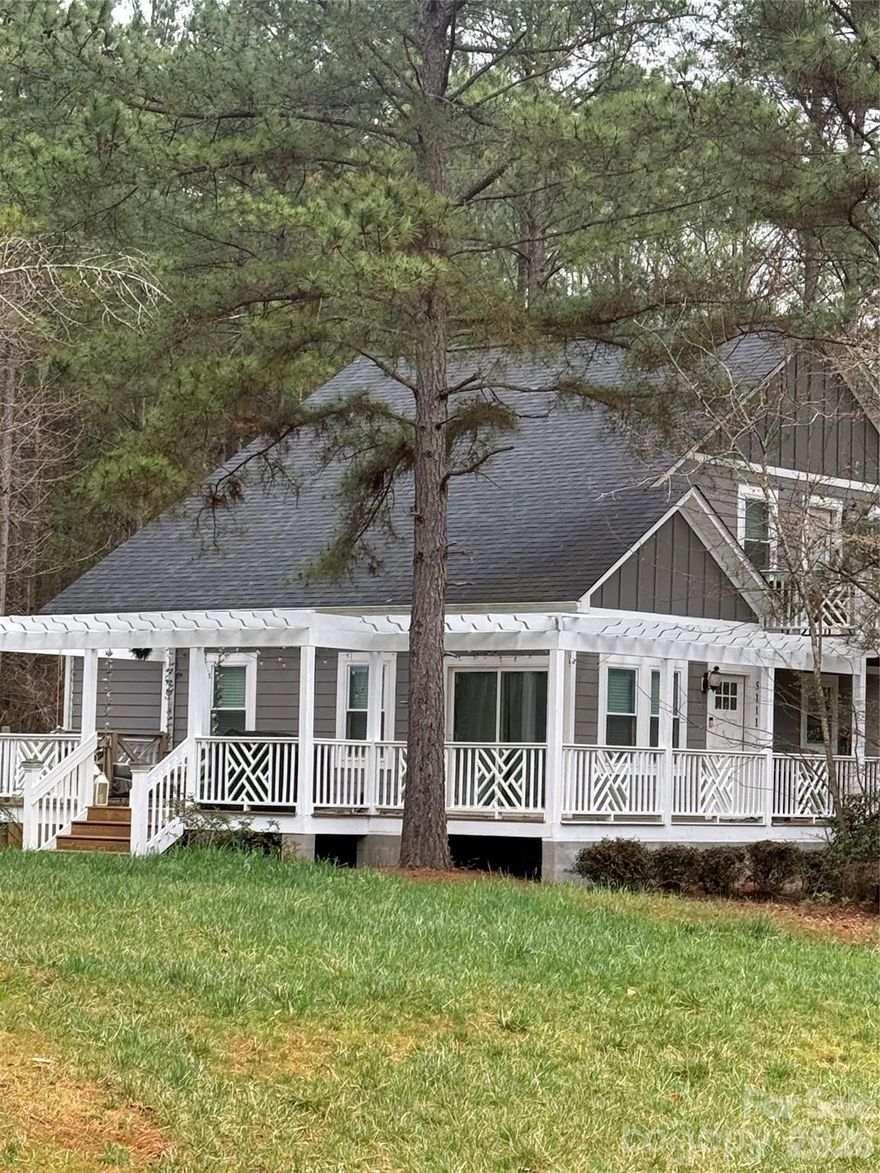 This beautiful home just got more affordable!  With an acceptable offer, the Seller if offering Buyer Incentive of up to $7,000, to be used towards closing costs or an interest rate buy down!!!  Large .69 acre lot, located in highly desireable Charlotte bedroom community area, just north of 4-85 and North Highway 16. Thoughtfully designed 3 Bedroom floorplan, maximizes space and light with a beautiful vaulted Greatroom and luxury vinyl flooring throughout.  You can enjoy versatile living with two primary bedrooms (one up and one down).  The upstairs suite is a true getaway with a huge walk-in closet and ensuite bath with a soaking tub and separate shower.  The kitchen features polished marble countertops, a large pantry and a beautiful wet bar/coffee station.  The home has a massive wrap-around deck, fire pit area, and balcony for three distinct ways to enjoy the fresh air. Convenient access to Charlotte Douglas International airport, Belmont, Riverbend Village, Lake Norman, shopping, dining, and the US National Whitewater rafting center.