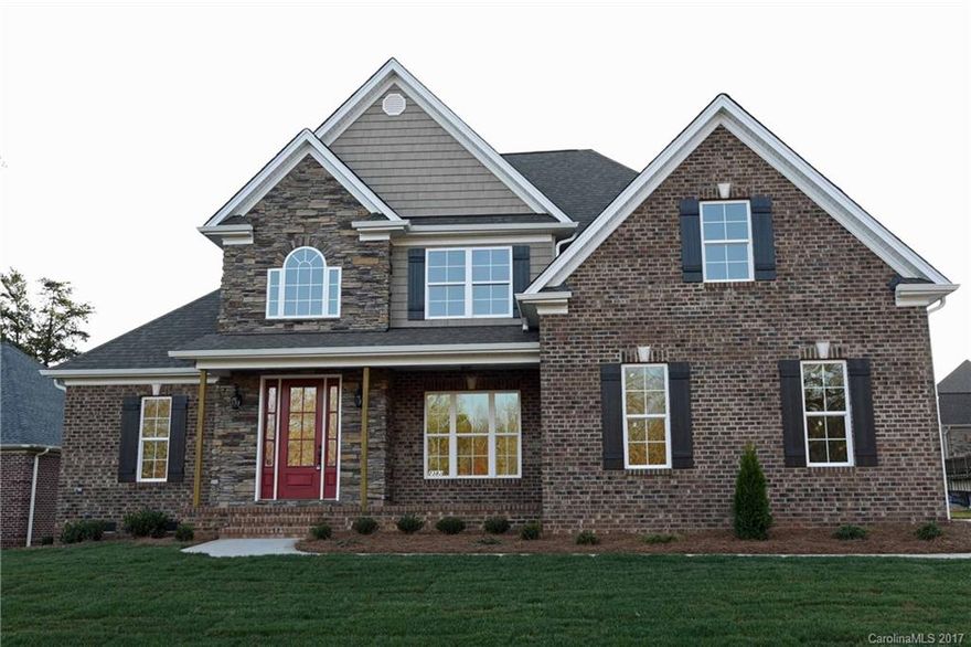 Like New home completed in 2016.  Open Floor plan w/coffered ceiling in great room & kitchen island with seating. Full brick/stone home w/Master Suite and 2nd bedroom on main floor, 5BR home and  Bonus room; you will love the outdoor living space w/oversized covered porch. All the extras of custom home: coffered ceilings, upgraded granite, free standing tub, SS appl, custom wainscoting, custom moldings, HW floors, tile baths.  Great schools & friendly neighborhood. Avail for immediate move-in.