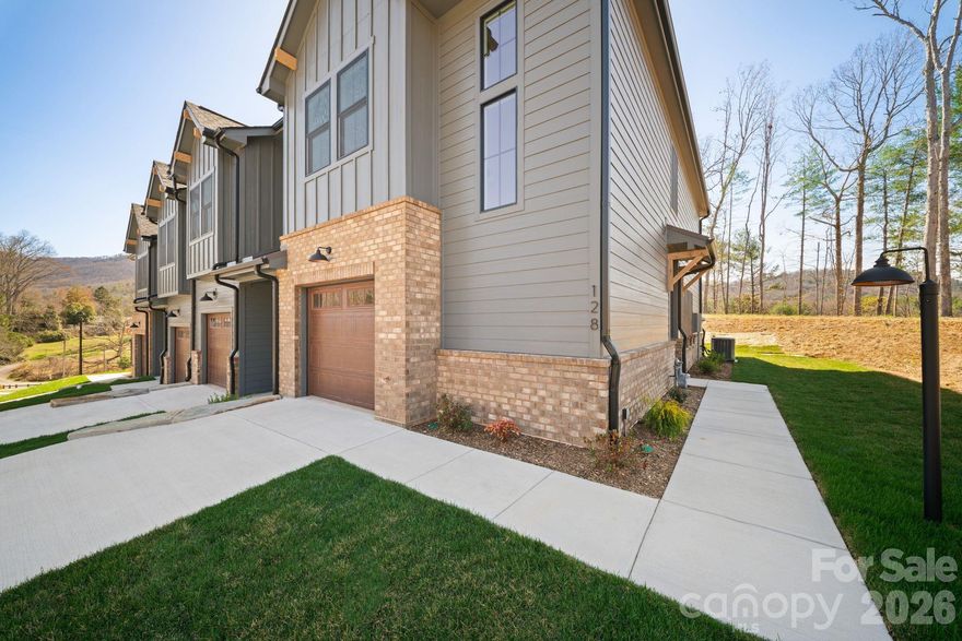 Stunning new townhome construction just completed in desirable north Asheville.  END UNIT townhome, almost 1600 square feet, pre-finished HW flooring, quartz tops, SS appliances and hood, covered back porch, one car garage, large primary bedroom with walk-in closet and shower, double vanity crown molding and more!  HOA covers exterior maintenance, landscaping, roads and common areas.  Located in Beaverdam Valley with beautiful long range views and close to Beaver Lake, the Country Club of Asheville, shopping restaurants and grocery stores, this location and price is tough to beat!