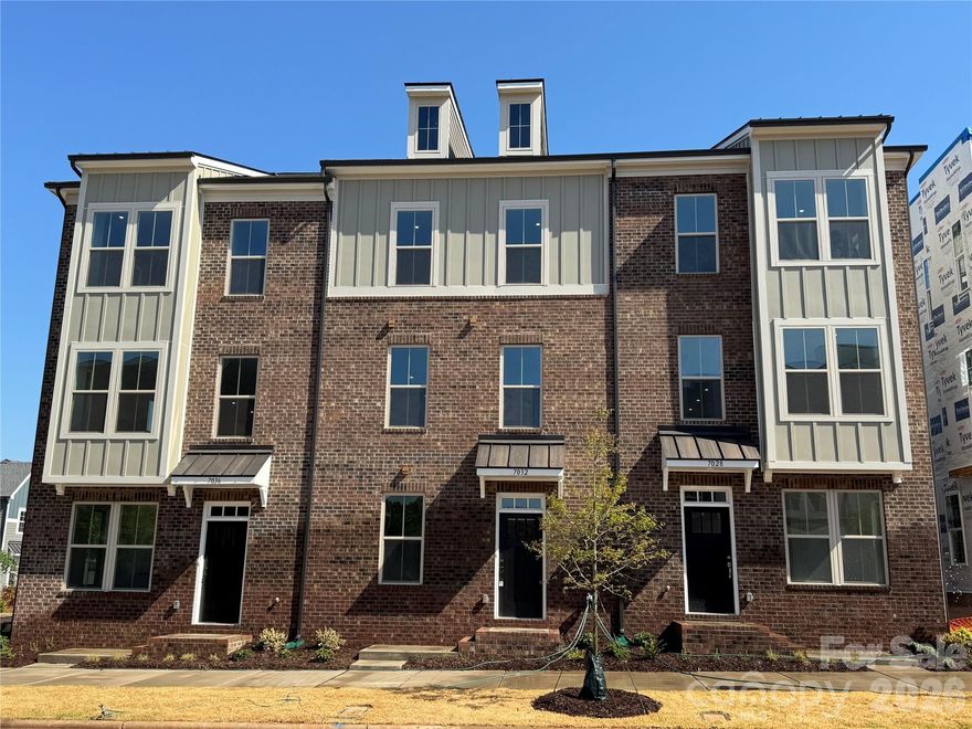 Welcome to The River District—a true master-planned community where lifestyle and location come together. 

This award-winning End Unit Landon three-story townhome offers a thoughtfully designed layout with a first-floor guest bedroom and full bath—perfect for visitors, multigenerational living, or a private home office.

The second level showcases a gourmet kitchen featuring quartz countertops, a built-in oven and microwave, electric cooktop, and soft-close cabinetry. The open-concept dining and living areas create an inviting space ideal for entertaining, while sliding glass doors lead to your private balcony that overlooks commons greens—perfect for relaxing or enjoying your morning coffee. 

Upstairs, you’ll find two beautiful owner’s retreats, each offering a bright, airy bedroom and a spa-inspired bath for ultimate comfort and privacy. A conveniently located laundry area completes the upper level. 

This home is filled with beautifully curated interior finishes, individually hand-selected by our professional design team, creating a cohesive and elevated aesthetic throughout.

Location is everything—and at The River District, you’re truly minutes from it all. Planned community amenities include a resort-style pool, clubhouse with fitness center, tennis and pickleball courts, parks, scenic trails, a working two-acre farm with an on-site farmer, and a riverfront amphitheater.

Experience vibrant, connected living in one of the area’s most exciting communities.