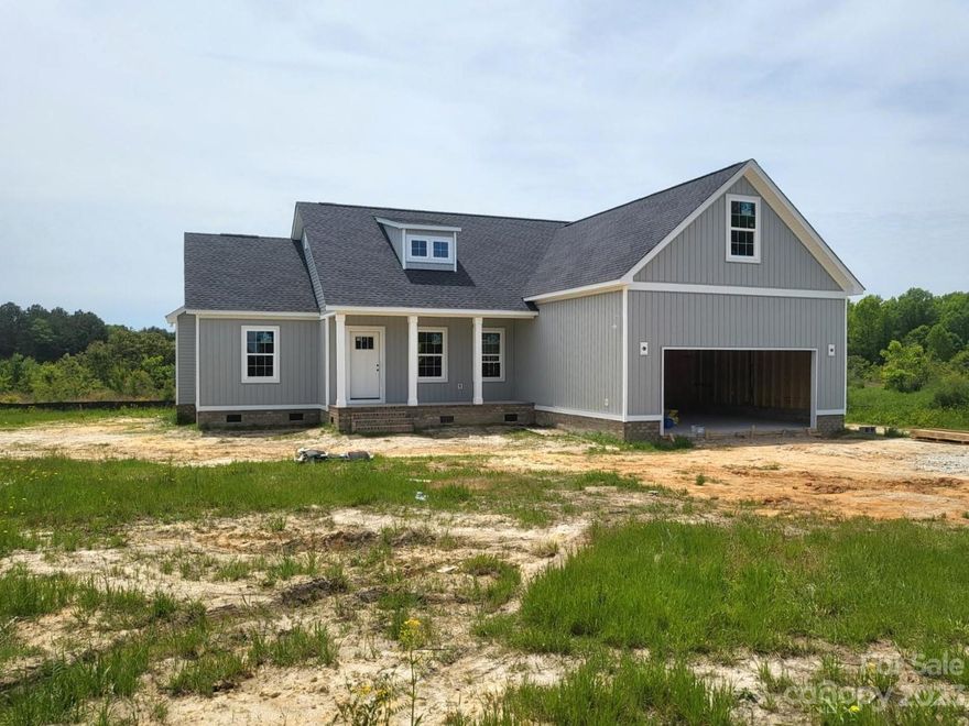 Homes by Christopher! Welcome to 1322 Philbeck Rd., York, SC Quality new construction by a reputable and seasoned builder, 29745! This 3/4 bedroom and 2 bath open floor plan home is dressed to the nines with high- end finishes and sits on 2 acres. (See Spec sheet in Associated docs) Build out a micro farm, enjoy your chickens or garden till your heart’s content. Cook in the beautiful kitchen with a work island that opens up to a spacious dining area. The covered rear porch provides a peaceful and relaxing space to enjoy the outdoors. This spectacular home has luxury vinyl tile in main living areas and granite in kitchen and bathrooms. Overall, the home offers comfort, style, and functionality and is ideal for anyone looking for their own comfortable living space. NO HOA!