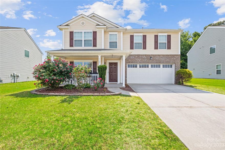 Welcome home to Willow Creek! Carefully situated less than 10 minutes from I-85. Home features granite counter tops, mosaic tile back splash, stainless steel appliances, laminate flooring on entire first level, and gas log fireplace. Primary bedroom boast vaulted ceiling, en suite with dual vanity, soaking tub, and separate shower. Second living space on the second level can easily be use for a multitude of purposes. Nice large lot that backs up to wooded area, backyard features a patio, fire pit great for entertaining, and a swing set for the kids. This home is move in ready!