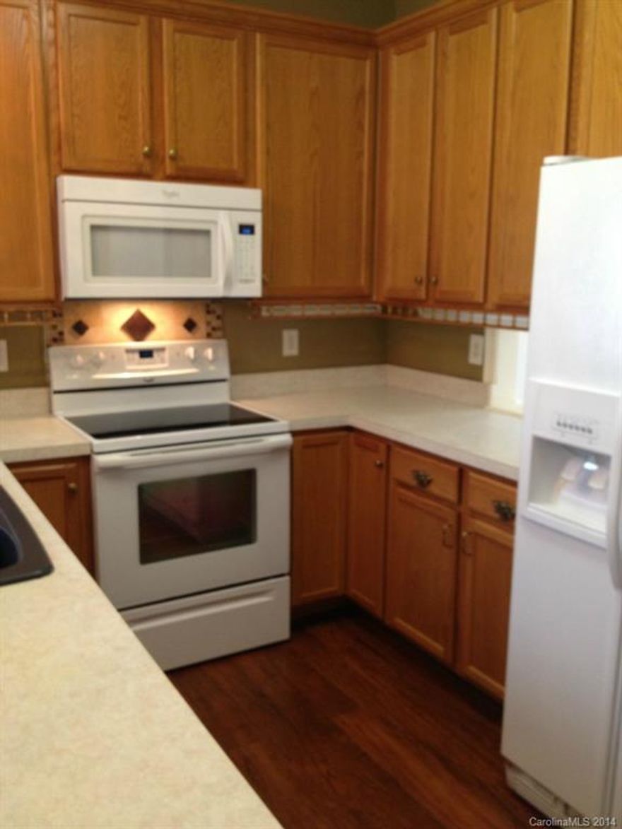 Great 3 bedroom/2.5 bath home with two Master Bedrooms.  One on the main level, and one upstairs.  Master on main includes a garden tub and dual sinks.  Includes Cherry Pergo flooring in the foyer and kitchen.  Lights in all the closets.  Plenty of storage.  Laundry room has sink.  Lots of upgrades and in immaculate condition.