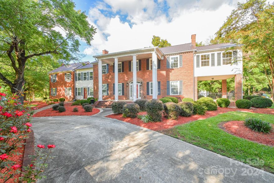 This colonial-style home, constructed in the 1950s, exudes elegance and showcases meticulous attention to detail both inside and out. Nestled on 8.3 acres, it offers 8 bedrooms, 3 bathrooms, 2 living rooms, a dining room, an oversized flex room, and a spacious basement. Additionally, there is a separate area that can serve as a mother-in-law suite, complete with its own entrance. The side porch and patio provide delightful spaces for entertaining. With remarkable curb appeal, the property features excellent storage options, including a dedicated storage shed and a wired garage/workshop. This home is truly timeless! Seize the opportunity to make this piece of history your own!
