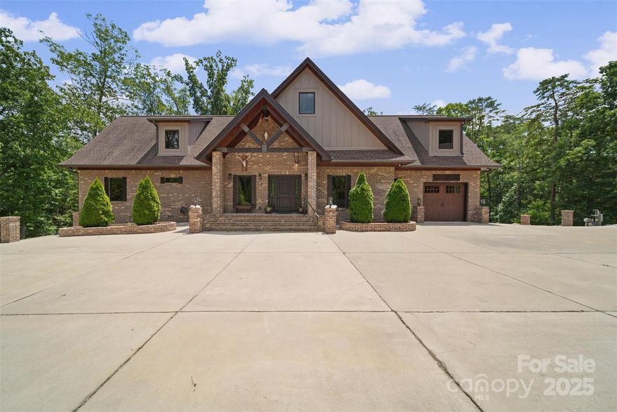Sprawling Custom Lodge in The Retreat at Sunset Ridge. Offering over 5,000 sqft of refined living space. With a wide-open floorplan & exposed wood beams, the home exudes character & craftsmanship from the moment you walk in. A gourmet kitchen—featuring one-of-a-kind cabinetry, Wolf gas cooktop, dual wall ovens, & a sizable center island. Flowing seamlessly into the living room, you’ll find soaring ceilings & cozy stacked-stone fireplace. A main-floor primary suite is a true retreat, w/ its own private balcony, extended dual vanities, & a walk-in shower. Additional highlights include spacious rec room, an upstairs loft, & 3 generously sized bedrooms—offering comfort & versatility. Outdoor perks: dual driveways for convenient access, Two covered RV/boat storage for your adventurous lifestyle. Top rated schools & a wide range of community amenities, this residence delivers both luxury & practicality in one remarkable package.