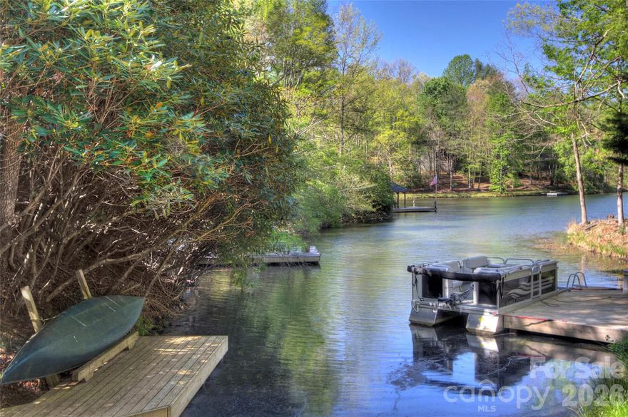 Perfectly positioned on a coveted level lot, this exceptional lakefront property offers rare, flat, and easy water access—ideal for swimming, kayaking, and enjoying the lake with ease. Just a short walk to the Connestee Falls pickleball courts, clubhouse, golf course, pool, wellness center, and tennis courts, the location is as convenient as it is desirable.
Thoughtfully updated throughout, the home blends comfort and style with a layout designed for both everyday living and entertaining. The spacious family room captures sweeping lake views and flows seamlessly to the outdoors, creating an inviting space for gathering with family and friends.
The primary suite serves as a private retreat, complete with a well-designed walk-in closet that combines function and elegance. Multiple outdoor living areas provide the perfect setting to relax, dine, and take in the peaceful waterfront surroundings. The hot tub conveys! A dedicated dog run adds convenience for pet owners without compromising the natural beauty of the property.
Whether hosting guests or enjoying quiet mornings by the water, this home embodies the best of lakefront living in one of Western North Carolina’s most sought-after communities. Level, updated, and directly on the lake at this price point—opportunities like this in Connestee Falls are truly rare.
Connestee Falls POA requires a one-time amenity fee of $14,000 at closing. Short-term rentals are permitted with a minimum 2-night stay.