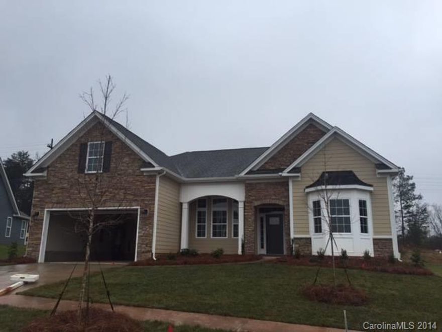 This is a beautiful ranch with a bonus room above the garage, large covered back porch over look the natural woods.  This house is very open and will be ready soon for move in.