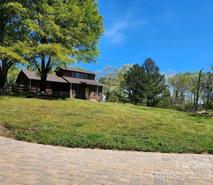 Country living at its finest! 
Spacious 3 bed/ 2.5 bath cedar shake/ brick ranch on over 10 acres. The open kitchen has been completely remodeled, with new brick flooring, countertops, backsplash, SS Appliances, SS farmhouse sink, and large island with an abundance of storage.
A living room big enough to host a crowd, with beautiful hardwoods throughout, and a chic whitewashed wood burning fireplace. Primary bedroom is oversized, with its own private access to the tranquil backyard. Step outside and enjoy the private backyard oasis with rocking chair front & side covered porches, brand new patio, in-ground pool, spa, and firepit.
Also featured on the property is a 3-stall horse stable, barn with sizable upstairs office, and hay storage. New fencing, gutter guards, new generator, Culligan water softener, and new paint are just a few of the many upgrades that have been made to this home.