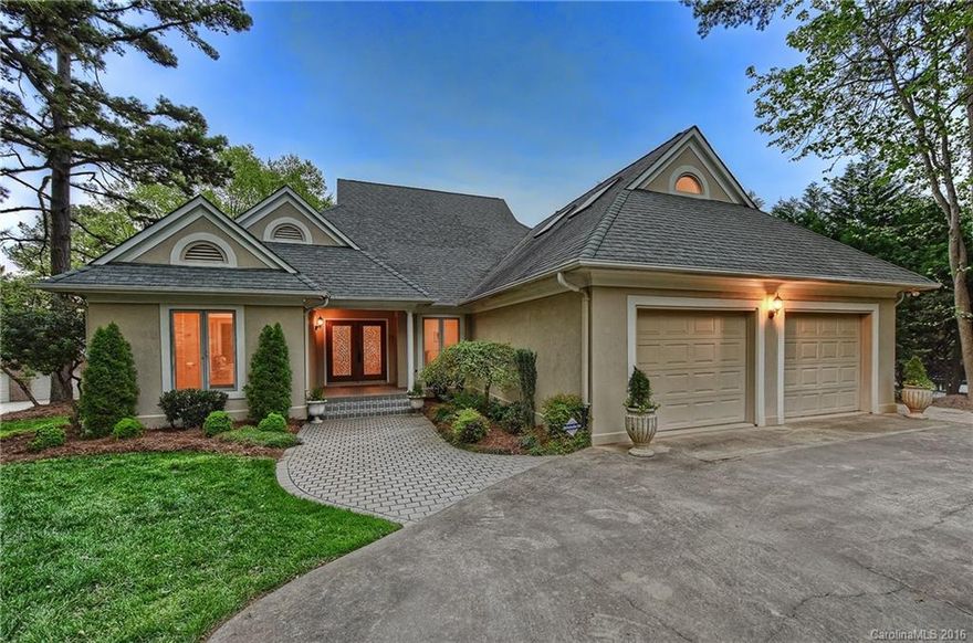 Fabulous Lake Norman waterfront in the heart of Cornelius. Desirable floorplan features vaulted great room w/ lake views open to a chef's kitchen & dining room w/ wet bar. Lakeside master suite & two bedrooms w/ private baths on main. Upper level home theater/5th bdrm w/bath & bonus room. 2nd living quarters on the lake level has guest suite, full kitchen & laundry;entertain w/ billiards,media room,bar & covered patio w/Koi pond. Sunset views from private 2-tier dock w/ sun deck. $179 per foot!
