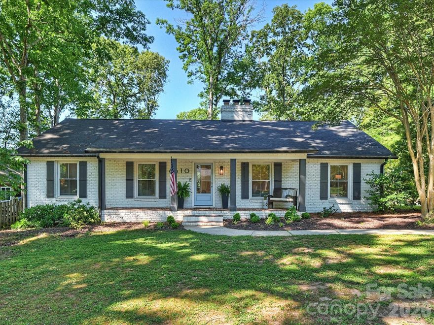 Stunning four bedroom brick ranch in sought after Stonehaven blends modern elegance with warm, inviting charm. Situated on a beautiful lot with mature trees and privacy this home offers stylish living spaces, designer finishes, and an open-concept layout perfect for both entertaining and everyday comfort. The heart of the home is the beautifully updated chef’s kitchen featuring an oversized island with seating and abundant storage. The spacious living and dining areas flow seamlessly together, creating a bright and welcoming atmosphere filled with natural light and gorgeous hardwood floors throughout.  The spacious primary suite offers a spa-inspired bathroom showcasing dual floating vanities, oversized walk-in glass shower with dual shower heads and serene modern finishes that create a true retreat experience. Spacious secondary bedrooms offer flexibility for guests, office space, or hobbies. The two car covered parking makes getting in and out a breeze and adds to the storage. Outside, enjoy peaceful mornings on the covered front porch or relax in the private backyard surrounded by mature trees and lush landscaping. Conveniently located close to shopping, dining, parks, and highly rated public and private schools this move-in ready home offers the perfect balance of timeless character and modern updates. Welcome home!