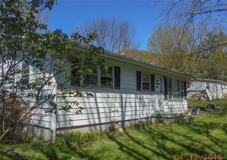 Mountain cottage in beautiful setting 1 mile from Waynesville Country Club. Needs love. Owner has made some renovations but TLC is needed. Beautiful level lot with hardwood trees. Fenced all around. . Roof was recovered in 2007. New hot water heater installed. New orange peel ceiling. New electric baseboard heat. Additional new kerosene Monitor heater. Kitchen has new cabinets and flooring. Selling "as is".