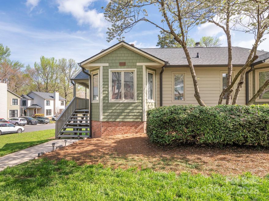 Enjoy low maintenance living in this lovely end-unit condo located in peaceful, tree-lined Ridgeview. Outside, the covered deck is a perfect spot to enjoy the surrounding trees & just relax. At the center of this home is the living room with its vaulted ceiling & handsome stone fireplace. The kitchen features white cabinets w/quartz countertops & marble tile flooring, which extends into the spacious dining area with a bay window. The main floor primary bedroom has a walk-in closet, built-in bookshelves & a remodeled ensuite bath w/quartz countertops, tile flooring & a walk-in tile shower. Downstairs, there are 2 bedrooms (one is huge), a full bath, plus a great storage area (189 SF). Per the sellers HVAC & water heater replaced in 2023. Located within timeless Zemosa Acres, very convenient to I-85, shopping & restaurants. Owner occupied only. Dues include lawn maintenance, property insurance for the building's exterior, most exterior maintenance, plus use of the outdoor community pool.