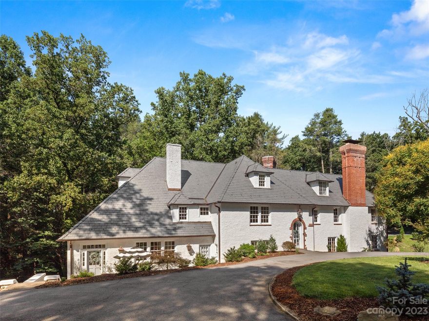 Experience an exquisite blend of timeless elegance & beautifully renovated sophistication, the epitome of luxury living in this meticulously restored historic home. Nestled in prestigious Biltmore Forest, it marries yesteryear's charm with modern comfort. Step through the grand entrance adorned with its original 100-yr-old refurbished chandelier sparkling like new - be transported to an era of grandeur. Indulge in the state-of-the-art gourmet kitchen boasting top-tier appliances and Italian Carrera marble countertops, embodying modern culinary luxury. The open design seamlessly connects kitchen, dining and living areas creating a harmonious space where family & friends can gather for memorable meals and engaging conversations. Historic luxury artfully modernized. A rare opportunity to own a piece of history while enjoying the comforts of current living, this is more than a home; it's a lifestyle refined by the past and designed for today's discerning connoisseur–your dream home awaits!