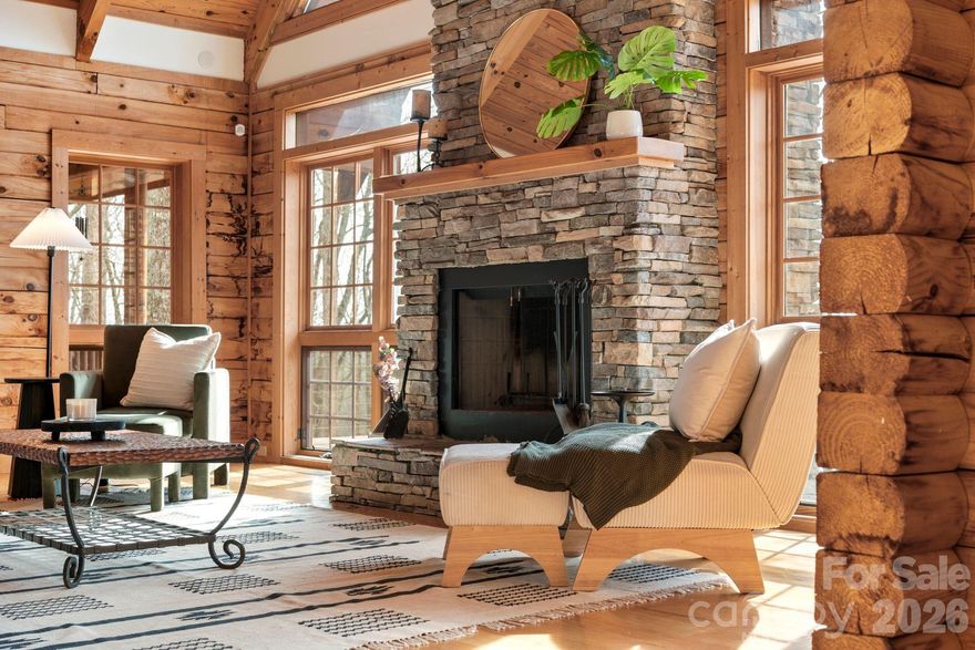 This is more than a mountain home—it’s where weekends slow down, memories are made, and everyone wants to gather.
Welcome to 219 Woodlyn Etch Drive, an inviting log cabin set on 1.5 private acres with year-round mountain views. Inside, a soaring two-story living room anchored by a stunning floor-to-ceiling stone fireplace creates the ultimate space for connection—whether it’s cozy nights by the fire or lively evenings with friends and family.
Step outside to the wraparound deck and take in the views in every season—morning coffee, sunset dinners, and evenings spent unwinding in the hot tub under the stars.
With space to host, room to relax, and the privacy you crave, this home is perfectly suited as a personal mountain retreat or a sought-after short-term rental. A place to unplug, recharge, and return to—again and again.