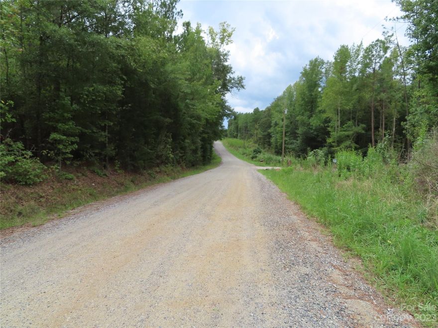 looking for a large building lot? Here it is! This wooded 5.17 ac lot is close to the I- 77 interstate, shopping & restaurants. The lot is wooded but you would need to install a well and septic tank.
Sign on the property.
Land has already been perked for a 3 bedroom septic system. The perk test shows a pump system but possibly could be changed to a non-pump system depending on where the house is placed.