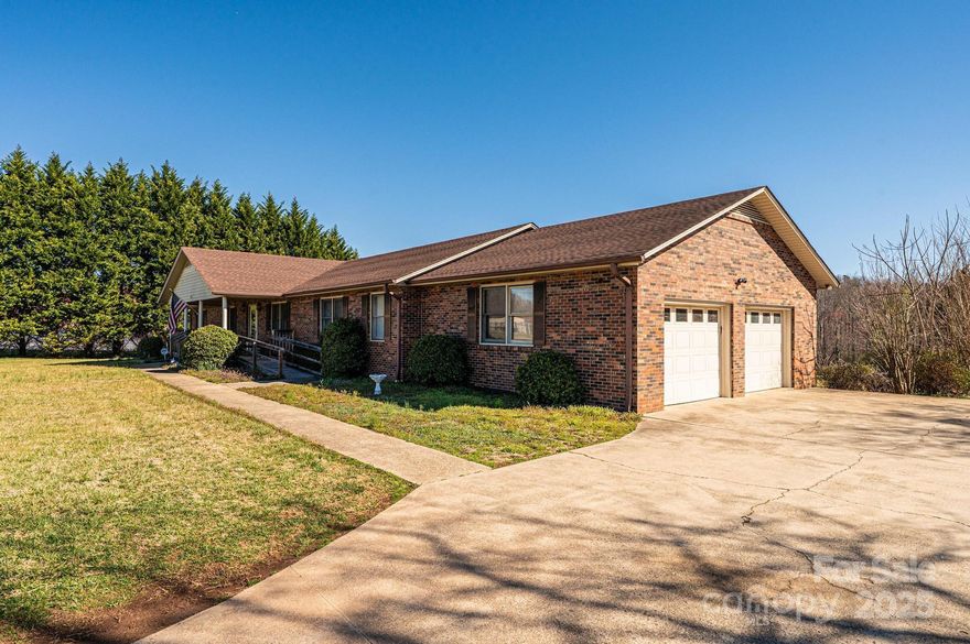 Spacious Brick Ranch Home with Business Zoning. This expansive 2,400 sq. ft. brick ranch-style home features a finished 1,300 sq. ft. basement, complete with a kitchen and half bath. With 4 bedrooms and 3.5 baths, this home offers ample space for comfortable living. The main level includes a 2 car garage, while the lower level provides an additional garage bay with its own garage door. The interior boasts a large kitchen and dining room, along with a  0.98-acre lot with 200 feet of street frontage, this home provides plenty of outdoor space, including a concrete patio in the backyard and a covered front porch with a ramp for easy access. A spacious driveway ensures ample parking, convenient for residential or business use. Zoned for business and currently operating as a licensed assisted living facility, this property offers a unique opportunity for investment or multi-use purposes. This home is located 27 minutes to Hickory, 22 Minutes to Morganton, and 32 minutes to Blowing Rock.