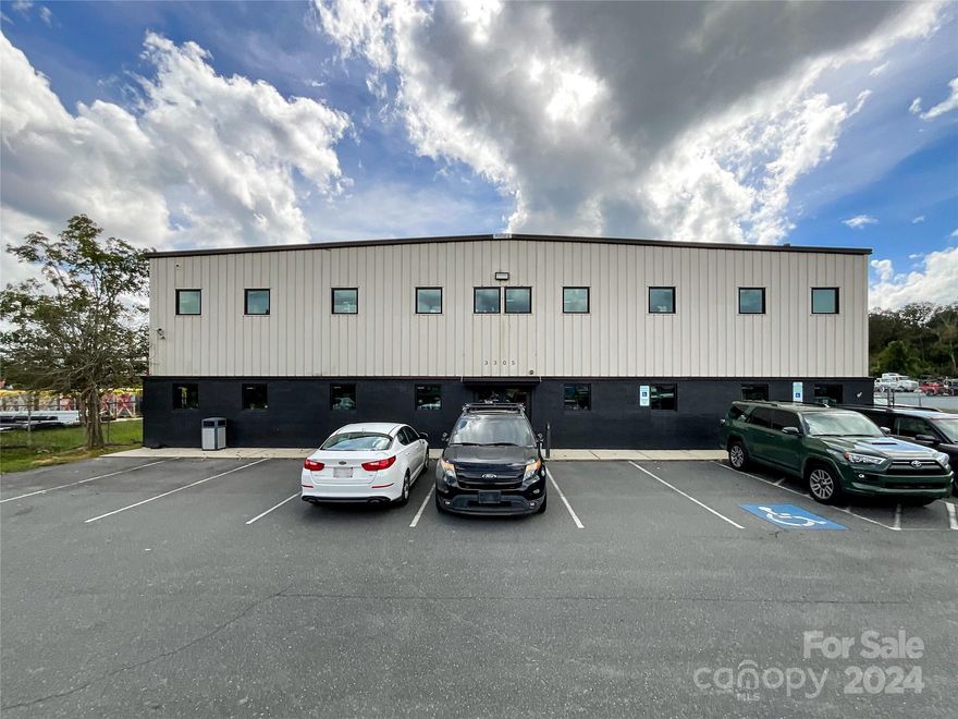 Explore a prime commercial property at 3305 Westwood Industrial Drive, Monroe, NC, priced at $2,185,000. This 13,425 square foot facility with 8608 sf of warehouse space and 4816 of office space, 26' wide drive up door and 10' wide drive up door, built in 1998 on a 1.04-acre lot, offers exceptional visibility and accessibility, being just moments away from Highway 74, the Monroe Bypass and Union County Airport. This strategic location not only simplifies logistics and commuting but also places businesses within an easy 25-mile drive from the bustling city center of Charlotte, enhancing its appeal for operations looking for a balance between suburban tranquility and urban proximity. This property stands as a versatile space for businesses aiming to expand or establish their presence in a growing economic region. Also see adjacent property for sale MLS: 4187963. There is a 1.04 adjacent lot with a large concrete pad that can be purchased separately. Crane does NOT convey.
