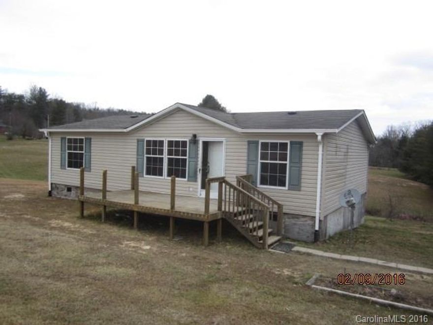 Lovely setting with rolling hills and an apple orchard across the road. Great place to call home with living room opening to the kitchen and split bedroom floor plan makes this an easy space to live. Easy drive to Hendersonville and placed right in the middle of apple country. Come out and make this house your home.