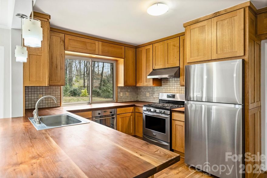 Freshly painted, popcorn ceilings removed and new poly in the crawl space create a welcoming home that is ready to be yours! Fig tree, peach trees and blueberry bushes are mature and fruit bearing! The kitchen cabinets are custom built on site and made of white oak with gorgeous solid walnut custom built countertops. One bathroom has a custom built walnut vanity and the other has a custom built hickory cabinet and vanity. New flooring in the rec room. Almost a 1 acre lot with plenty of space to add a pool! This home has been meticulously maintained. The neighborhood is quiet and offers lots of privacy. Chimneys being sold in "as is" condition; no known problems.