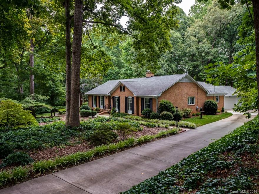 Charming Updated Brick Traditional Ranch on "Picture Perfect" Private Lot w/ Majestic Trees, Mature Landscaping w/ Custom Deck and Water Garden Feature-Gorgeous! Open Kitchen/Den/Sunroom; Updates Include Kitchen w/ Tile Flooring and Silestone Countertops (2012), Roof (2008), A/C (2014), Furnace (2008), WH (2013), Exterior Painted (2013); Lovely Molding Detail, Hardwood Floors Throughout Most of Home; Attached Oversized Two Car Garage w/ Workshop & Pull Down Storage; Don't Miss This Special Home!