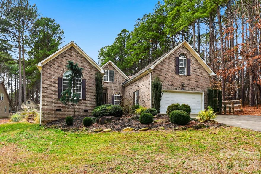 Nestled within the desirable Somerset on Lake Norman community, this classic brick home offers refined comfort and effortless indoor–outdoor living, complete with your own private pool! Recently refreshed with newly refinished hardwood floors and fresh interior paint throughout, the home presents a bright, move-in-ready interior designed for everyday living and elevated entertaining. Vaulted ceilings soar above the living room, where a striking fireplace elevates the space and creates an inviting, warm focal point. The open-concept layout flows seamlessly into the dining area and an expansive kitchen, equipped with granite countertops, stainless steel appliances, a generous island, a built-in wine rack, and ample cabinetry — thoughtfully designed for gathering and connection.
The main-level primary suite offers privacy and convenience, featuring a large en suite with dual vanities, a soaking tub, and a separate shower. Secondary bedrooms are generously sized and share a full bathroom for convenience. The upper level offers you an additional living area, and the flexible bonus space is ideal for a home office, guest retreat, or creative studio. Outdoors, a covered patio overlooks the fenced pool, creating a private backyard oasis perfect for summer entertaining and relaxed evenings at home. This residence delivers everyday livability with the feel of a year-round retreat!