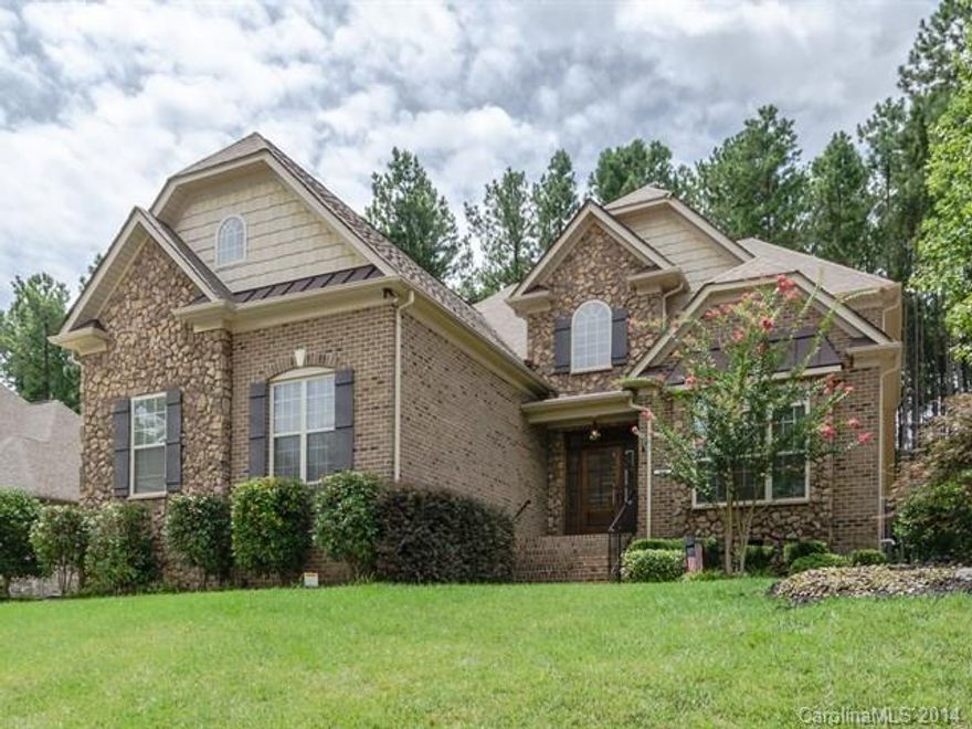 Priced way below tax value! Beautiful home one mile from Lake Wylie! Priced to sell! Master on main, formal dining & living. Great room has vaulted ceiling w/stone fireplace. Beautiful iron staircase. Kitchen has gas cook top, SS appliances. Hardwood floors throughout & security system. Prewired for surround sound. Large bonus could be used as 5th bedroom. Private backyard.  Neighborhood pool with walking trails & boat/RV storage. Only 26 miles from Charlotte Airport. Great Clover School system.