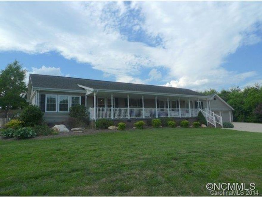 Like new 2006 Palm Harbor on frame modular. Spacious design has 2 bedrooms with private baths. Huge dining/living room with hardwood floors, gas fireplace and doors leading to rear deck. Kitchen with island, walk in pantry and breakfast area. Large family room off kitchen. Full length covered front porch, tilt vinyl windows, Vortex vinyl siding and 3 car insulated oversized garage. Adj 2 acre lot is included DB886 page 214.