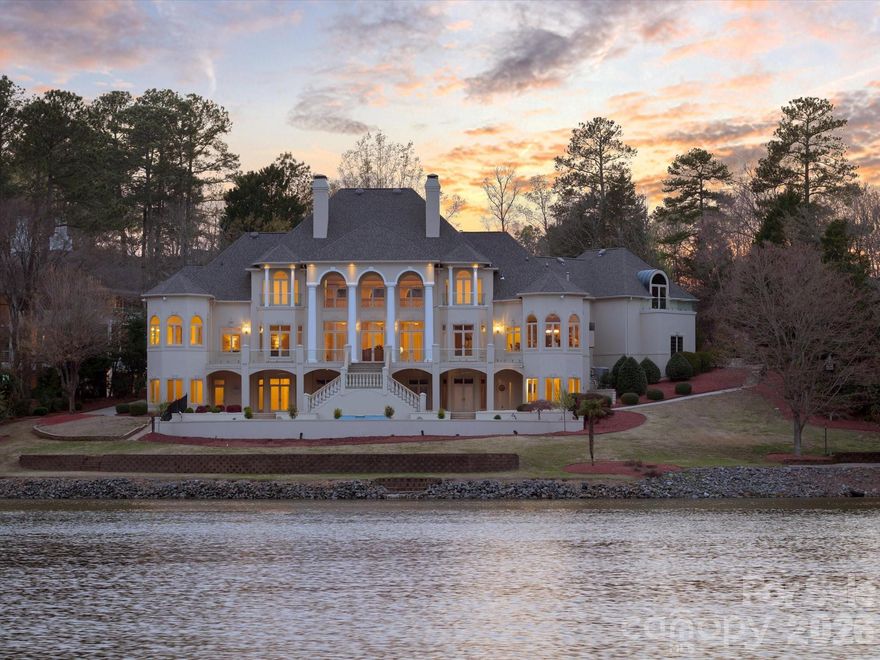 A Charlotte Estate of Unrivaled Luxury on Piper Glen Lake
 Discover a truly one-of-a-kind waterfront estate nestled in the heart of Charlotte, overlooking the serene lake at Piper Glen Country Club. This stately residence presents a unique opportunity for today's discerning buyer, offering meticulous finishes and detailing rarely found.
 The inspiring, grand entrance immediately captivates with panoramic lake views from this notable property. Step inside to soaring ceilings, exquisite marble floors, and custom designer lighting. The main living spaces open seamlessly to a sprawling rear terrace, inviting the beauty of the outdoors in.
 The gourmet kitchen is a chef's dream, appointed with Wolf and Subzero appliances, a center island, and breakfast bar and a sunny breakfast room—the perfect setting to start your day. Adjacent is a cozy keeping room with a fireplace, while the elegant formal dining room and butler's pantry are ideal for sophisticated entertaining.
 The spectacular Primary Suite is a true sanctuary, featuring a fireplace, expansive sunrise views, and two private baths complete with a morning bar, steam shower, bidet, and custom dressing areas.
 The upper level is home to three spacious ensuite bedrooms, each with a balcony overlooking the lake, built-in desks, and expansive walk-in closets. This floor also includes a flexible room perfect for an office and an expansive bonus room with a built-in wet bar, balconies, and convenient laundry facilities.
  The lower level is dedicated to amazing recreational amenities, including a home theater with stadium seating, a fully outfitted bar, and versatile space ready for billiards, poker, and home gym. It also features a private office and a pool bath with a changing area, which opens to an expansive summer porch overlooking the pool and spa. The shoreline offers a tranquil terrace with a tree canopy and a dedicated fishing spot. Additional practical luxuries include an elevator servicing all three levels and an additional lower-level garage with workshop space and Private Guest Retreat!  Presenting in pristine condition and ready for immediate occupancy, this distinguished estate is truly one of Charlotte's finest. Welcome to the ultimate in vacation living, every day. Perfection awaits in Piper Glen—Welcome Home.