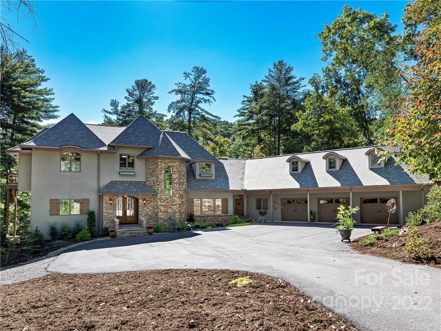 Enjoy beautiful sunrises and an abundance of natural light in this private, low-maintenance home in The Cliffs at Walnut Cove. Recently updated throughout, it features a completely renovated kitchen, new primary suite on the main floor, and mudroom/laundry room. The chef’s kitchen showcases professional level SS appliances and induction cooktop. A second primary suite upstairs features walk-in closets and nearby sitting room/office and additional laundry room.  An elevator provides easy access to all floors, including two additional bedrooms, family room and bonus room on the lower level.  This home is perfect for entertaining with the large in-ground saltwater pool, and outdoor kitchen.  Abundant storage throughout the house, three-car garage and plenty of extra parking. The nearby babbling stream adds to the ambience in the large, fenced backyard. Close to Walnut Cove’s trail system and the state-of-the-art Wellness Center with pools, tennis courts, and more. Membership Available