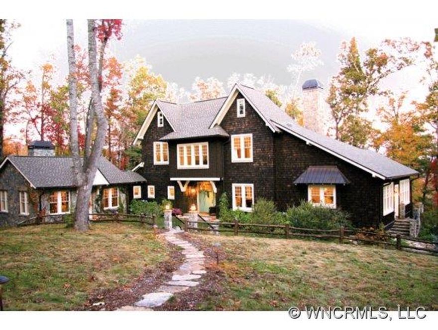 Exceptional Platt Architecture classic mountain estate with beautiful views situated on 20.0 level acres in The Reserve just minutes from downtown Brevard. This exquisite home features an incredible, professionally designed kitchen with Sub Zero and Viking appliances, hardwood floors, elevator, fabulous bathrooms and charming attached stone cottage. Beautiful gardens and stone terrace with firepit make this home a wonderful mountain getaway!