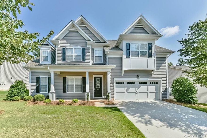Immaculate Home in desirable Fort Mill location. Large flat yard that backs to trees w/full irrigation-hard to find in this location! Gourmet kitchen opens to beautiful two story great room. Kitchen w/granite, tile backsplash, gas cook-top, double ovens,SS appliances,tile floor & built in desk. Beautiful wood floors & ceramic tile down. Master bed w/trey ceiling, bay window,walk-in closet & large master bath. Second floor has loft, 3 beds & 2 full bath. Community pool & close to the interstate.