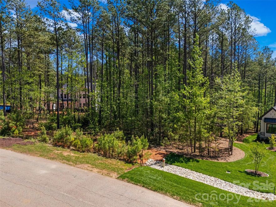 Located in the highly sought-after Riverchase Estates community, this 1.009-acre homesite offers a blend of privacy, natural beauty, and established neighborhood charm. Backing up to one of the community's scenic walking trails, the property provides a serene, wooded backdrop ideal for your custom dream home. Enjoy building within an established section where you can experience the lifestyle and connect with neighbors.
Riverchase Estates is a gated community along the picturesque Catawba River, known for its preserved landscapes and upscale amenities. Residents enjoy access to a clubhouse, fitness center, tennis courts, playground, amphitheater, outdoor pool, and miles of tranquil nature trails winding through peaceful woodlands. Canoeing and kayaking opportunities along the river further enhance the community's appeal.
Bring your own builder with no required timeframe to build, offering flexibility for immediate plans or future investment. Conveniently located just 30 minutes from Charlotte and minutes from Indian Land, Fort Mill, and Ballantyne, this homesite offers quiet, nature-filled living with easy access to shopping, dining, and everyday conveniences.
