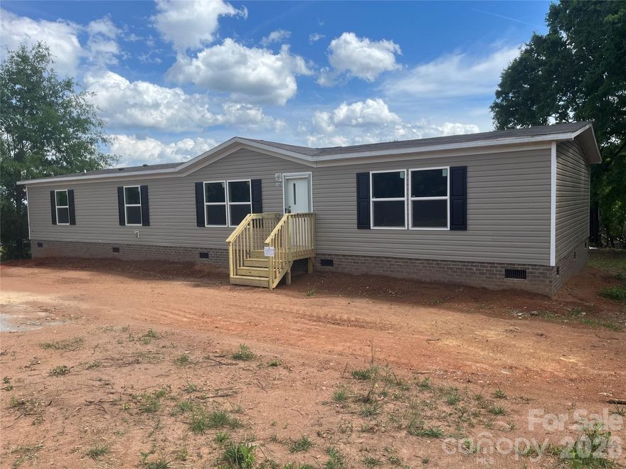 Welcome to this charming 2024 New 28' x 68' TRU Pride (TRU28684R) 4-bedroom, 2-bath doublewide home on a one acre lot. It offers plenty of space, comfort and privacy. As you enter the home, you are greeted by a spacious open floor concept with the living room filled with natural light from the large windows. Just off the living area, the formal dining room and family room provides a generous space for gatherings and creating a warm and inviting atmosphere. The kitchen showcases all new appliances and a large island perfect for meal prep and additional seating. The primary room includes a large walk-in closet and a private full bathroom. Three more bedroom offers plenty of space for everyone.  A convenient walk-in laundry room is located just off the kitchen.  Additional highlights are the home will have a One-Year warranty with Bennett Homes and the home is Energy Star Rated making your power bills more affordable and is FHA approved.  Don't miss the opportunity to make this wonderful property your home.  Call today to schedule your private showing!