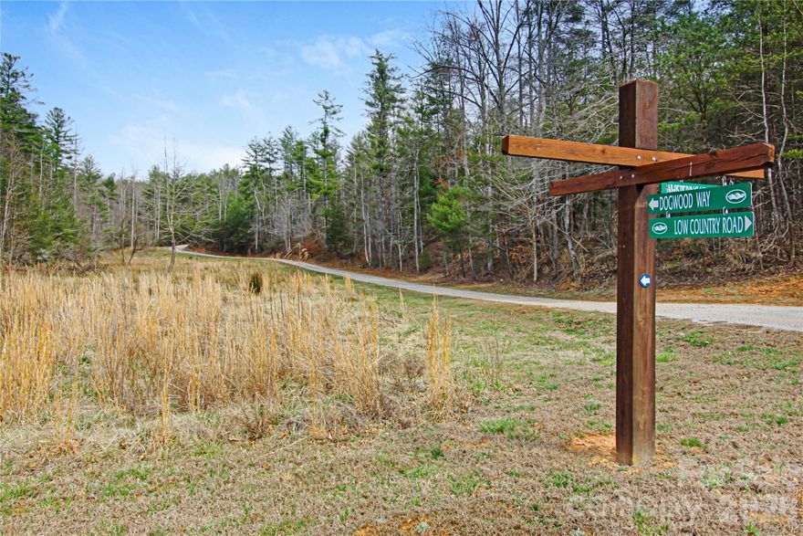 Discover spacious mountain living on this 13.73-acre mostly wooded homesite in the gorgeous gated community of The Coves Mountain River Club. This rare, large parcel delivers excellent privacy with room to roam, including a small cleared pasture area ideal for gardening, horses, or open space amid mature forest. A practical, accessible building site reached via an established logging road makes it highly buildable while preserving seclusion.
Conveniently situated near the mountaintop Pisgah Mountain Lodge clubhouse, the lot offers peaceful privacy with subtle close-range mountain views that enhance the natural setting.
Spanning over 3,200 acres in the Blue Ridge Mountains, The Coves provides an unmatched lifestyle. The 6,000-square-foot Pisgah Mountain Lodge features an expansive veranda, saline swimming pool, hot tub, a fitness center with locker rooms, a great room with vaulted ceilings and a three-sided fireplace, full kitchen, pool table loft, game room, and lending library. Weekly social events foster a strong sense of community.
Residents enjoy miles of trails for hiking, biking, horseback riding, and UTV adventures, plus two equestrian centers, including Round Mountain Ranch. The community offers over five miles of Johns River frontage with kayak access, fishing spots, and picnic pavilions, along with community gardens, a vineyard, dog park, pickleball courts, cascading waterfalls, and more than 30 resident clubs with planned activities.
This substantial, private lot near the clubhouse presents a rare opportunity to build your custom mountain retreat in one of North Carolina’s most desirable gated communities. Just minutes from Lenoir, Blowing Rock, Morganton, and the Blue Ridge Parkway — and about 1.5 hours from Charlotte or Asheville.