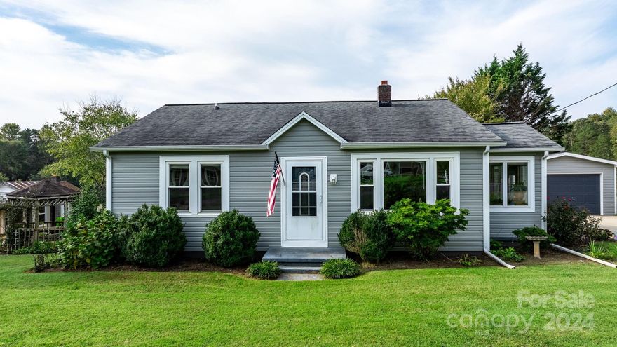 Fall in love with this most adorable cottage style home.  So many personal touches were added when this home was completely renovated in 2013.  Very artsy kitchen with small island and farmhouse style sink.  Primary bedroom with roomy ensuite that sports a very modern mid-century style.  Home in move in condition with nice sunroom added for reading or relaxing.  The large lot is fully fenced in to keep those pets safe.  There is a single detached garage and a separate 2 car carport.  A small building included that was originally going to be an art studio but can be converted into many other options.  Well cared for and ready for the new owners.  You won't be disappointed in person.  Minutes from downtown Hickory but quietly situated on a dead end street.